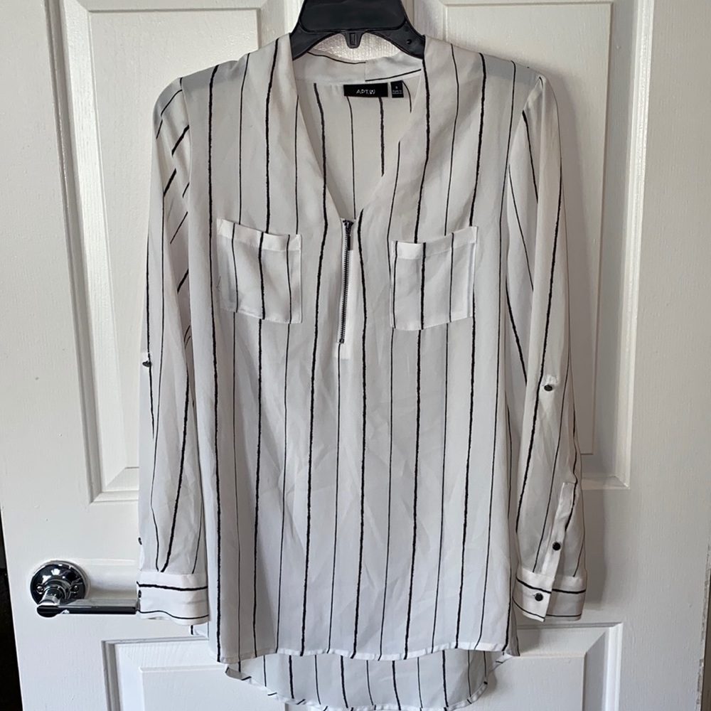 Long sleeve half zip blouse.